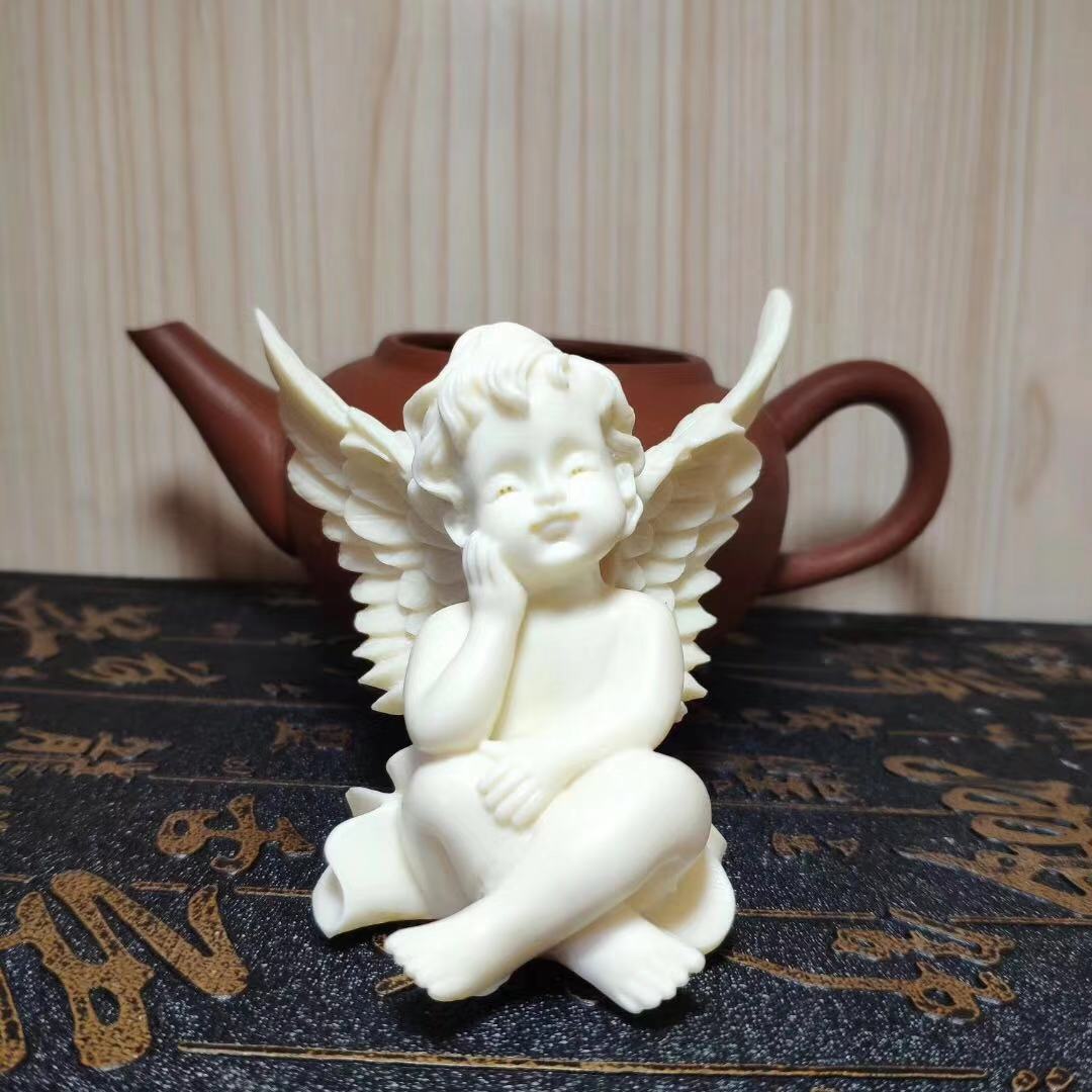 Ivory Fruit Angel Figurine